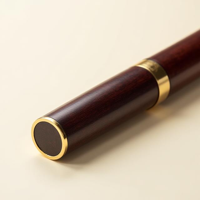 Hand-turned rosewood oblique pen holder with brass flange